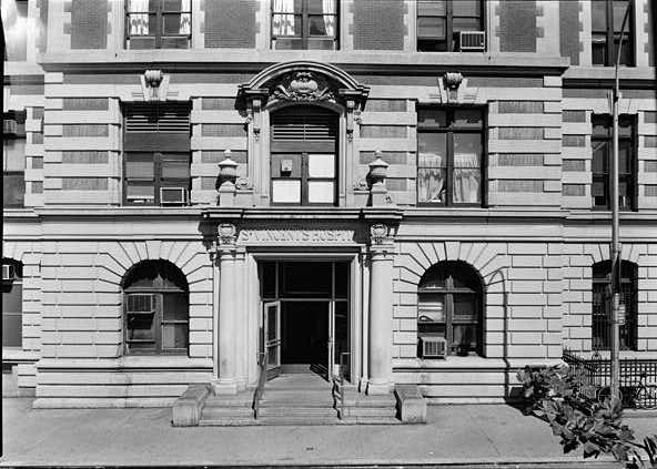 A black and white photograph of the front of St. Vincent’s hospital. 