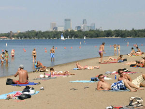 lakeside beach with Minneapolis skyline in the background