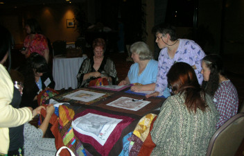 a group of fans quilting