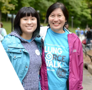 2 women who appear to be Asian, one wearing a t-shirt that says Lung Force Walk