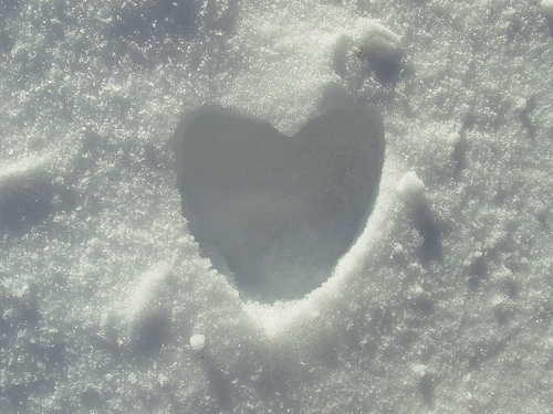 A heart-shaped indentation in the snow.