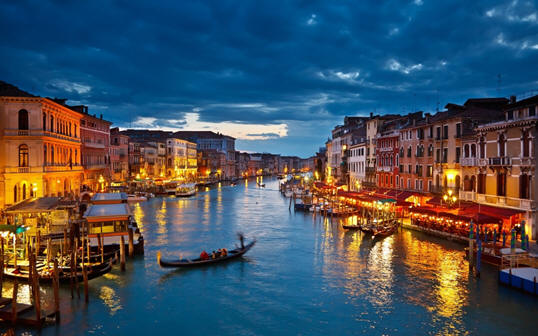 A photo of the canals of Venice in the evening